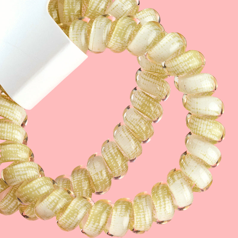 M42 two plaid-printed telephone cord hair ties in a box