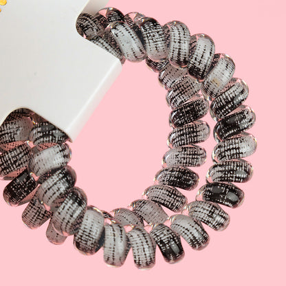 M42 two gray-series telephone cord hair ties in a box