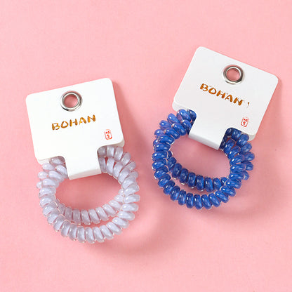 M42 two milk-blue series telephone cord hair ties in a box