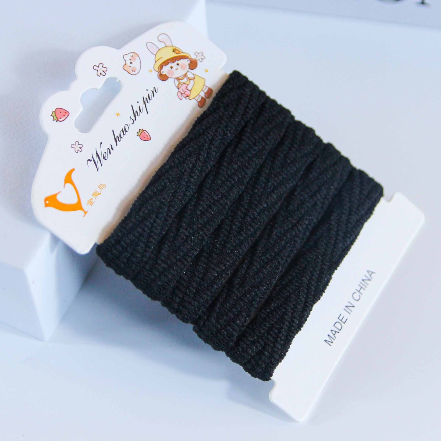 M42 5 black cotton hair ties on a card