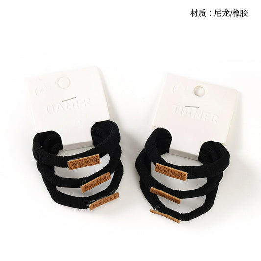 M42 3 Black Labeled Hair Ties in Box