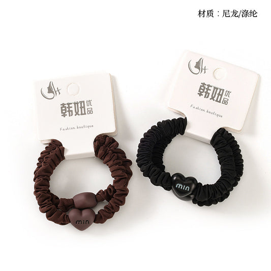 M42 two heart-accessory small hair scrunchies in a box