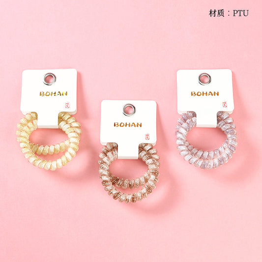 M42 two plaid-printed telephone cord hair ties in a box