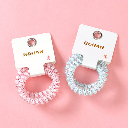 M42 two raindrop-printed telephone cord hair ties in a box