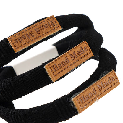 M42 3 Black Labeled Hair Ties in Box