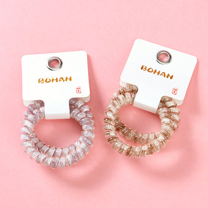 M42 two plaid-printed telephone cord hair ties in a box