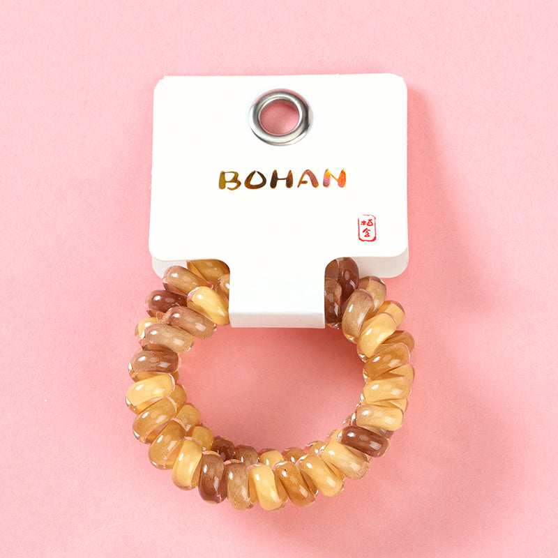 M42 two color-block telephone cord hair ties in a box