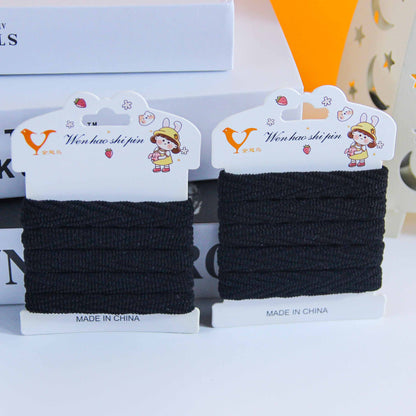M42 5 black cotton hair ties on a card