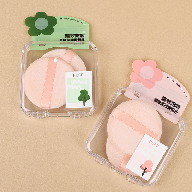 La caja YH-15 contiene dos borlas (para polvos sueltos) M.50 