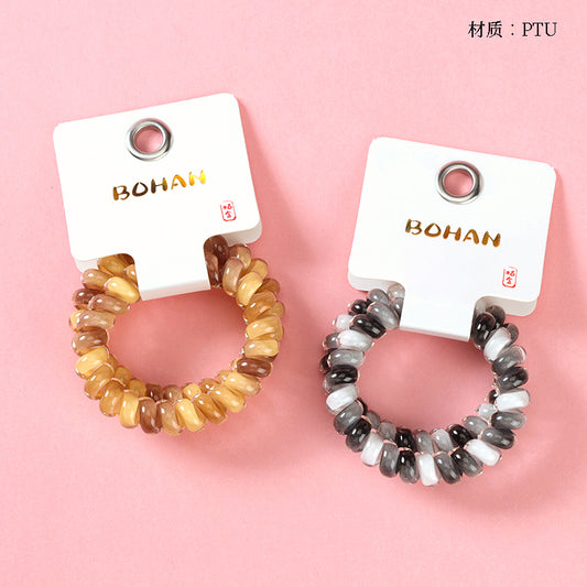 M42 two color-block telephone cord hair ties in a box